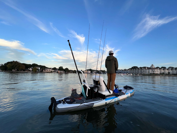 man fishing on paddle board