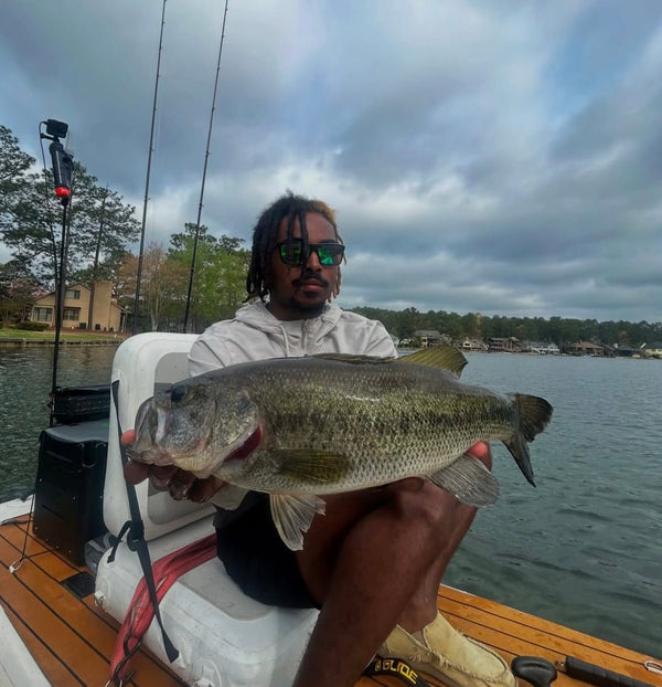 man with a fish on a paddleboard