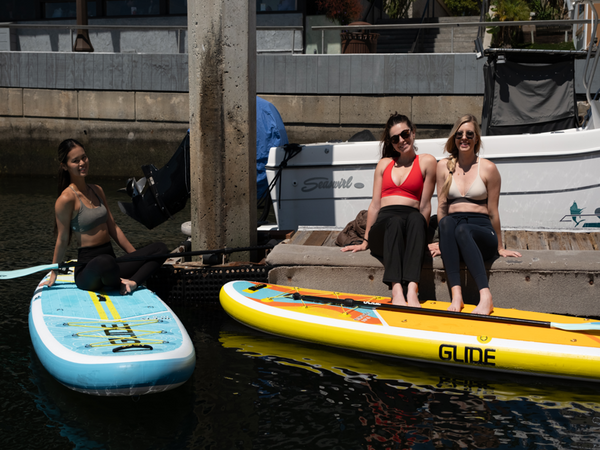 women on paddle boards