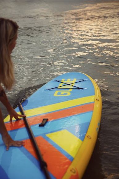 woman on inflatable paddle board