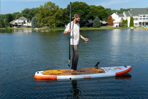 man fishing on a paddle board