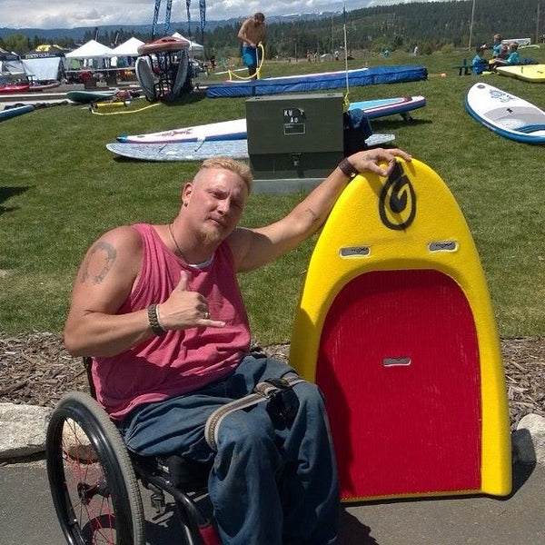 man with handicap modified paddleboard