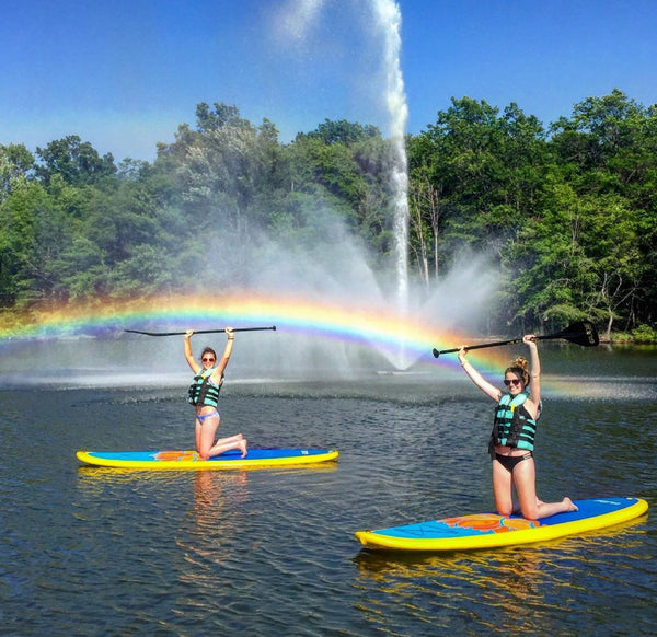paddle boards and a rainbow