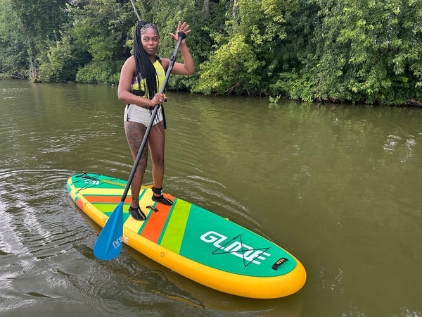 woman on an inflatable paddle board