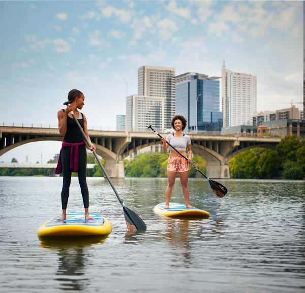 women on paddle boards