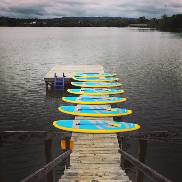 paddle boards on a dock