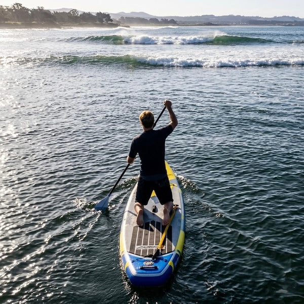 man on paddle board in waves