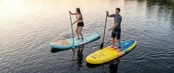 Two people on inflatable paddle boards