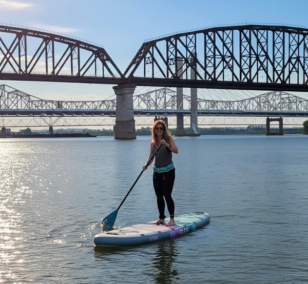 woman on inflatable paddle board