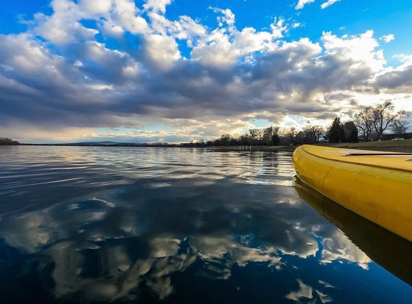 paddle board with clouds